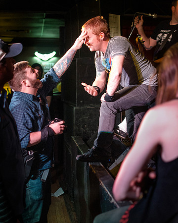 Photographer TREVOR HATTER gives a bit ofencouragement to TORCHES TO TRIGGERS singerCHRIS KREUGER